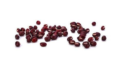 High angle view of coffee beans against white background