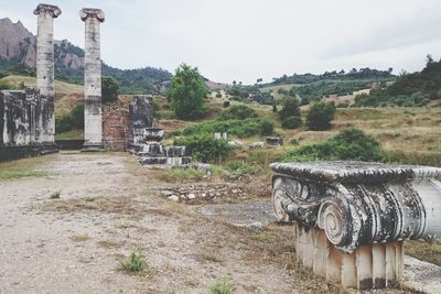 Built structure on field against sky