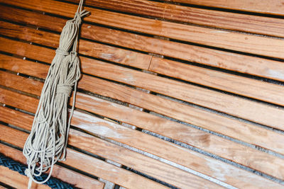 High angle view of wood on floor against wall