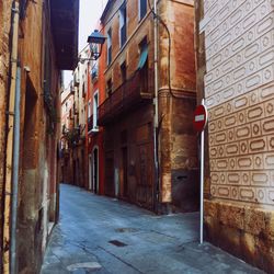 Alley amidst buildings in city