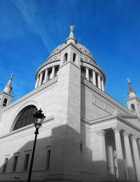 Low angle view of church against blue sky