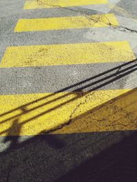 High angle view of yellow zebra crossing on road