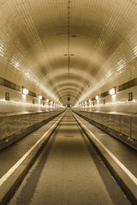 Empty illuminated underground walkway