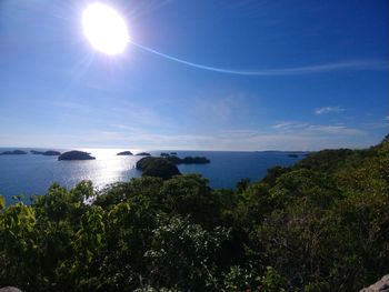 Scenic view of sea against sky on sunny day