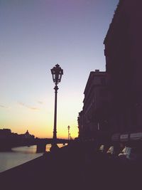 View of street light against sky at sunset