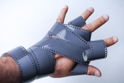 Close-up of human hand against white background