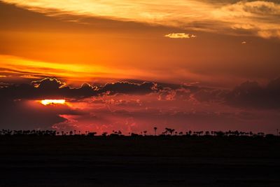 Scenic view of dramatic sky during sunset