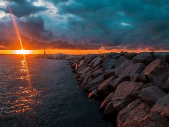 Scenic view of sea against sky during sunset