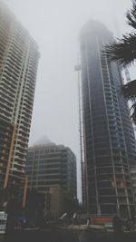Low angle view of skyscrapers against clear sky