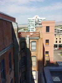 Buildings in city against sky