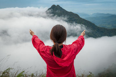 Rear view of woman against mountain