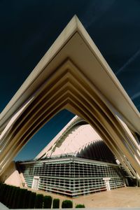 Low angle view of modern building against blue sky