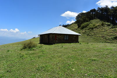 House on land against sky