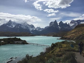 Scenic view of lake against cloudy sky