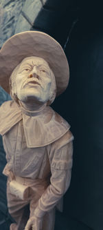 Close-up of statue against black background