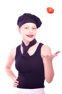 Portrait of smiling young woman against white background