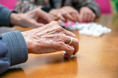 Cropped image of man holding hands