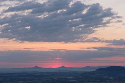 Scenic view of silhouette mountains against sky during sunset