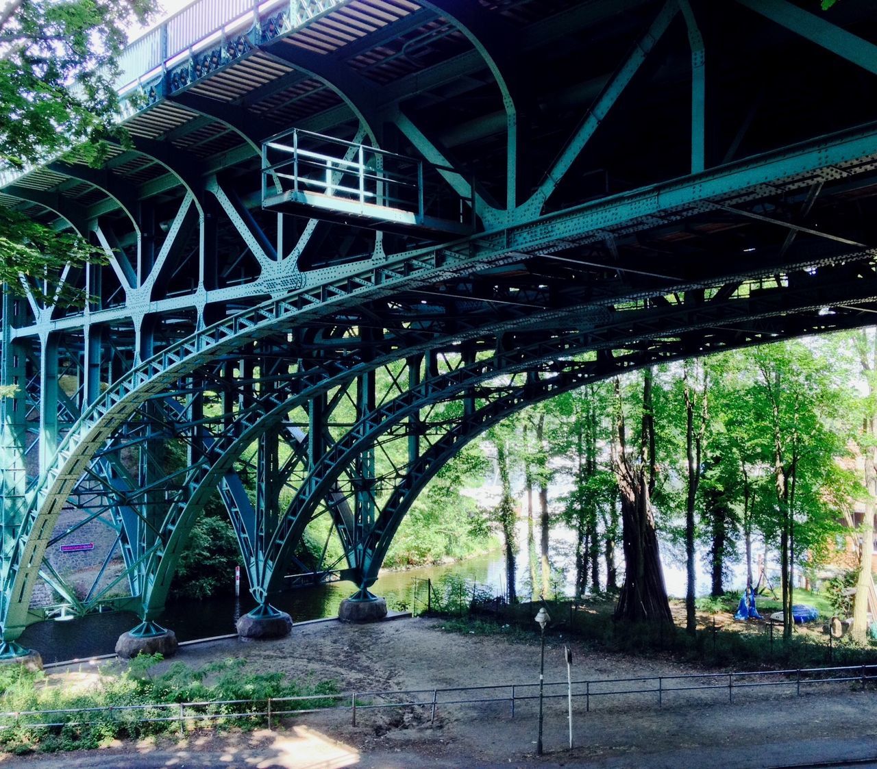 built structure, architecture, bridge - man made structure, connection, water, tree, arch, arch bridge, reflection, park - man made space, bridge, footbridge, engineering, river, outdoors, plant, no people, growth, nature, low angle view