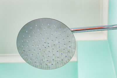 Close-up of shower against wall