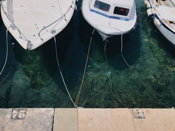 High angle view of boats moored at pier