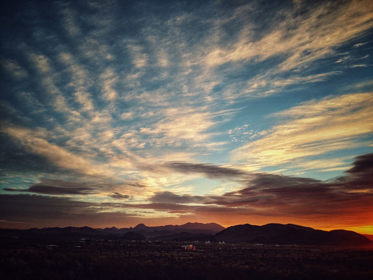 SCENIC VIEW OF LANDSCAPE AGAINST DRAMATIC SKY