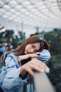 Portrait of young woman standing outdoors