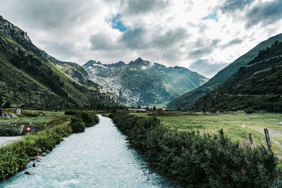 Scenic view of landscape and mountains against sky