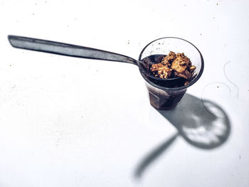 High angle view of breakfast on table against white background