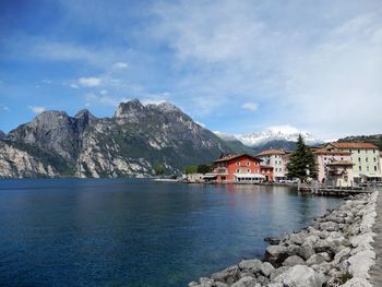 Scenic view of sea and buildings against sky