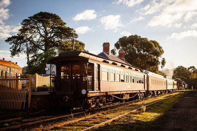 Train on railroad track against sky