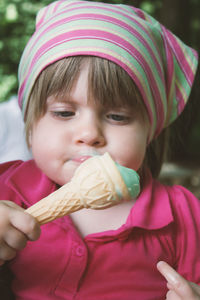 Close-up of cute little girl eating ice cream
