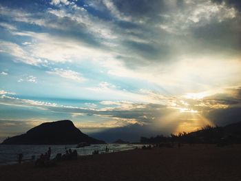 Scenic view of beach against sky during sunset