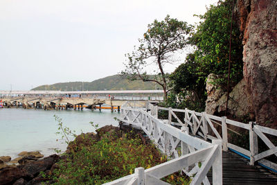 Bridge over sea against sky