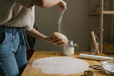 Young woman making christmas cookies