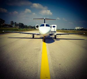 Illuminated street light against sky