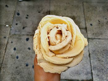 Close-up of hand holding ice cream