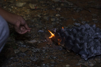 Cropped image of person on bonfire