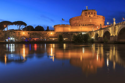 Reflection of illuminated buildings in water at night