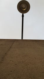 Low angle view of lamp post against clear sky