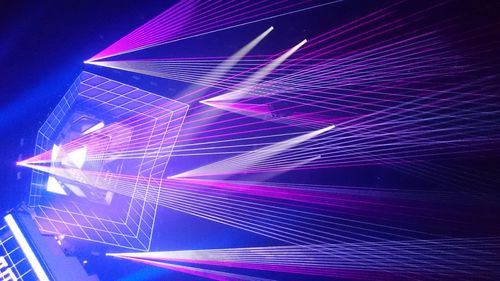 Low angle view of illuminated lights at night