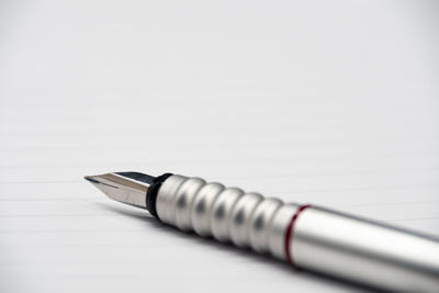 Close-up of pen against white background