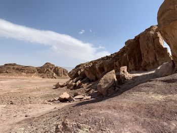 Rock formations on landscape against sky