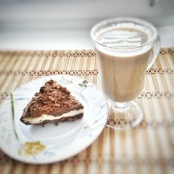 Close-up of cake and drink on table