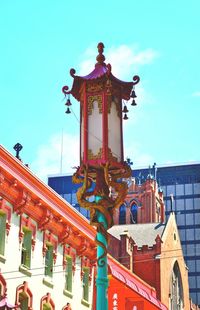 Low angle view of built structure against blue sky