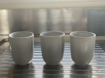 Close-up of empty coffee cup on table