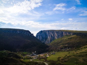 Scenic view of landscape and mountains against sky