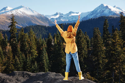 Full length of woman standing on mountain