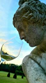 Close-up of statue against sky
