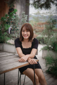 Young woman sitting on chair